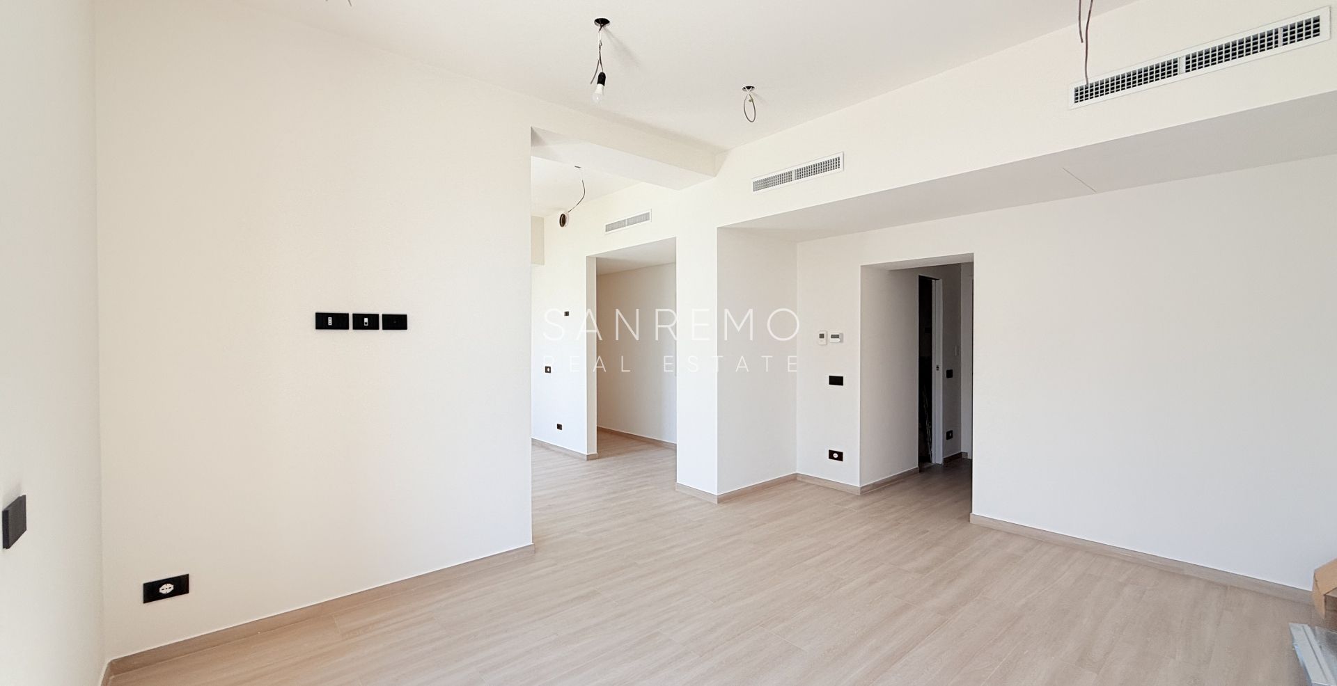 Appartement neuf avec vue mer, balcon et parking dans un immeuble moderne de construction récente